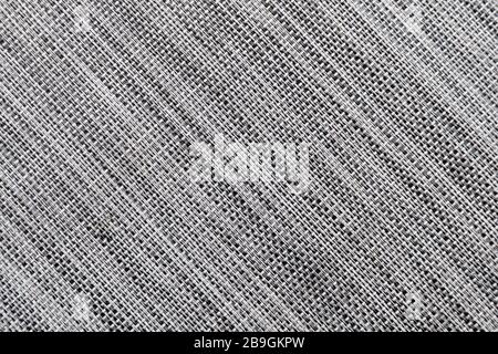 Mottled grey synthetic fabric woven in tones of grey Stock Photo
