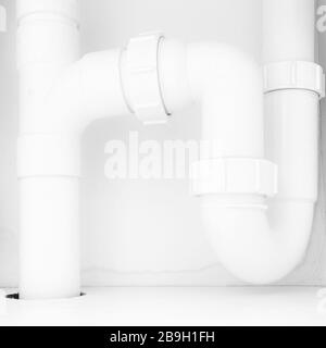 Drain pipes under a kitchen sink with dishwasher connection Stock Photo - Alamy