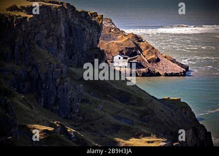 Deserted boathouse at Worm's Head, Gower Peninsula, Wales, UK Stock Photo