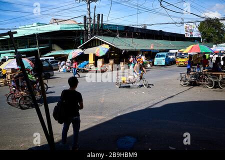 Rickshaw riders in the streets of the Carbon public market. Stock Photo