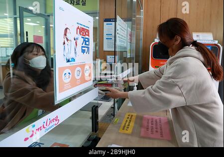 (200324) -- SEOUL, March 24, 2020 (Xinhua) -- People borrow books in a library in Daegu, South Korea, March 24, 2020. South Korea reported 76 more cases of COVID-19 compared to 24 hours ago as of midnight Tuesday local time, raising the total number of infections to 9,037.    The newly confirmed cases stayed below 100 for the third straight day. Of the new cases, 20 were imported from abroad. (Newsis/Handout via Xinhua) Stock Photo