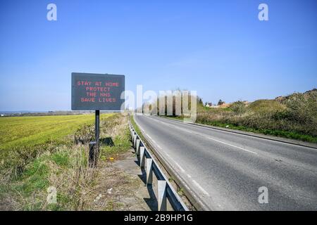A matrix road sign on the A367 into Bath advises motorists to stay at home to protect the NHS and save lives the day after Prime Minister Boris Johnson put the UK in lockdown to help curb the spread of the coronavirus.