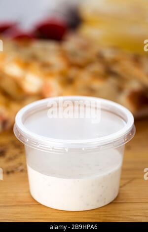 Dip sauce in a plastic take away container isolated on white background  Stock Photo - Alamy