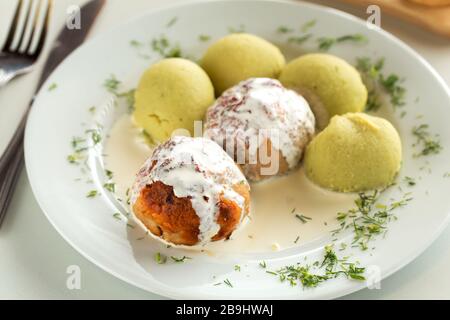 Turkey meatballs with mashed potatoes garnish and white sauce Stock Photo