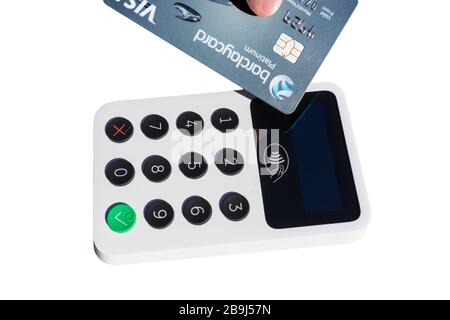 iZettle contactless card reader and visa barclaycard credit card on white background Stock Photo