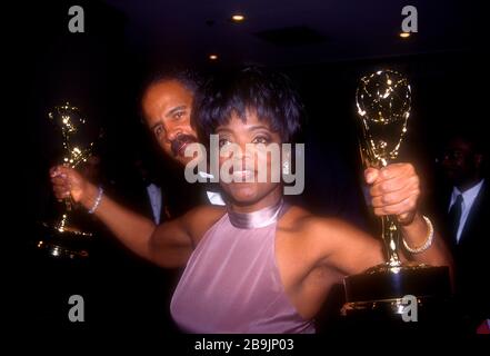 ***FILE PHOTO*** Oprah Winfrey Announces Boyfriend Stedman Graham Is Practicing Social Distancing After Traveling. Credit: Walter McBride/MediaPunch OPRAH WINFREY AND STEDMAN GRAHAM 5/19/95 DAYTIME EMMY AWARDS MARRIOTT MARQUIS HOTEL, NYC. CREDIT ALL USES Stock Photo