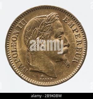 Part 20 francs in gold Napoleon III 1864 Albert-Désiré Barré (1818-1878). Pièce de 20 francs en or de Napoléon III, 1864. Or. 1864. Paris, musée Carnavalet. Stock Photo