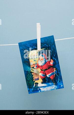Christmas card hanging on clothesline Stock Photo