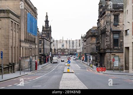 Edinburgh, Scotland, UK. 24 March, 2020.  Deserted streets in the heart of the Old Town tourist district in Edinburgh. All shops and restaurants are closed with very few people venturing outside following the Government imposed lockdown today. Pictured; View along George IV Bridge street. Iain Masterton/Alamy Live News Stock Photo
