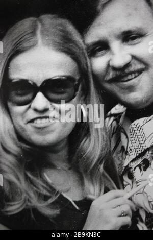 A happy fashionable couple in the 70s of a happy couple. Stock Photo