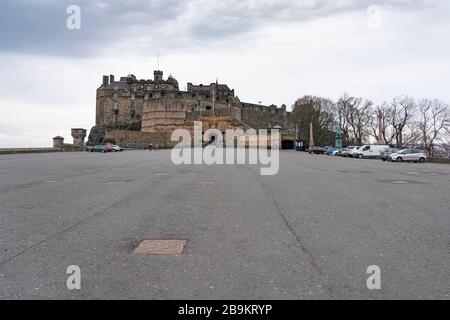 Edinburgh, Scotland, UK. 24 March, 2020.  Deserted streets in the heart of the Old Town tourist district in Edinburgh. All shops and restaurants are closed with very few people venturing outside following the Government imposed lockdown today. Pictured; Empty esplanade at Edinburgh Castle. Iain Masterton/Alamy Live News Stock Photo