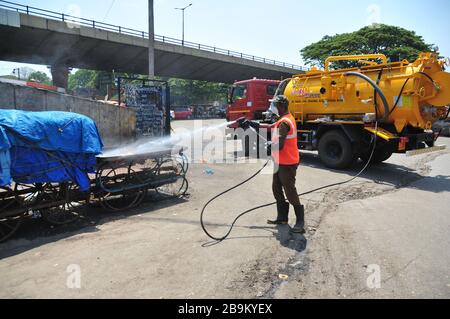 Bangalore, India. 24th Mar, 2020. An Indian fireman sprays disinfectant in Bangalore, India, March 24, 2020. The number of confirmed COVID-19 cases in India has reached 519, India's federal health ministry said Tuesday evening. Credit: Str/Xinhua/Alamy Live News Stock Photo