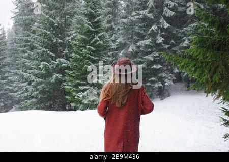 Woman wearing winter hiking outfit, shooting on white background