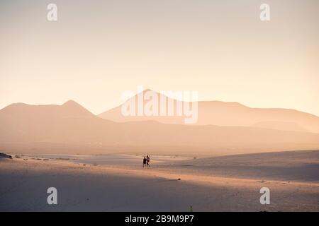 People walking the sandunes at Parque Natural de Corralejo Corralejo Fuerteventura Canary Islands Spain Stock Photo