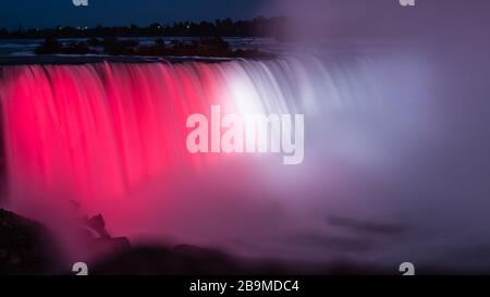 Colorful light shedding on the Niagara Falls Stock Photo