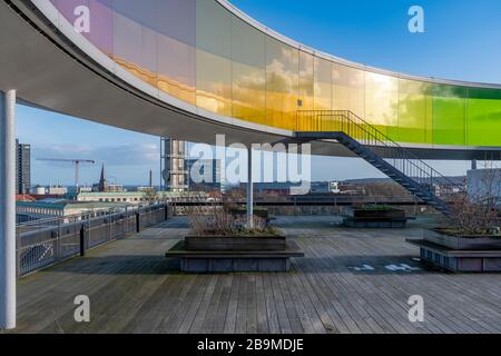 Your Rainbow Panorama by Olafur Elliasson sitting on top of the ARoS art gallery in Aarhus in Denmark. Glass walls fade through rainbow colours. Stock Photo