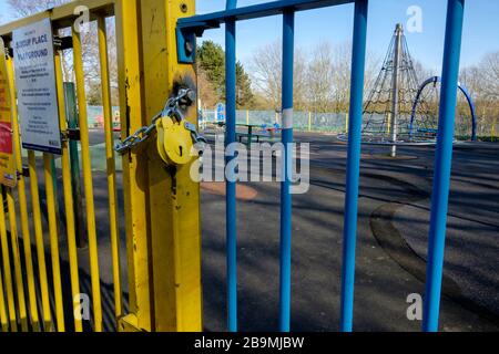 A local authority children's playground is padlocked to prevent entry under the UK Government's social distancing enforcement measures. Stock Photo