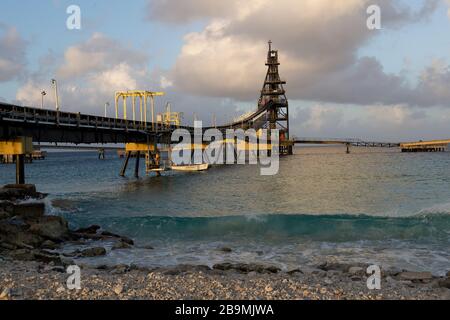 Salt pier conveyor to transport salt to ship loading Bonaire, Caribbean Stock Photo