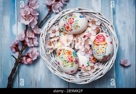 Decoupage decorated Easter eggs with cherry blossom flowers Stock Photo