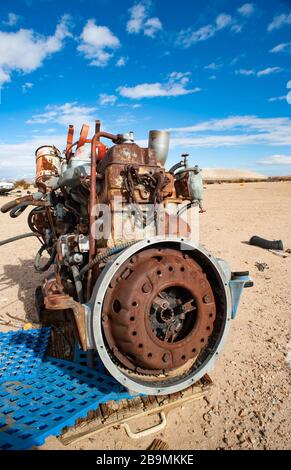 Old rusty engine in a Mojave desert junkyard Stock Photo