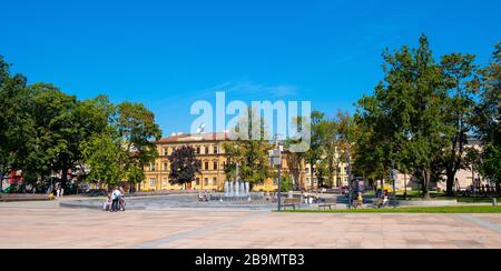 Lublin, Lubelskie / Poland - 2019/08/18: Panoramic view of Plac Litewski square with multimedia fountain in historic old town quarter Stock Photo