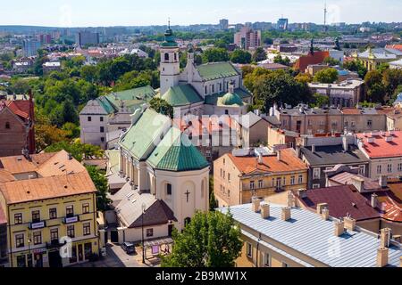 Lublin, Lubelskie / Poland - 2019/08/18: Panoramic view of historic old town quarter with St. Peter Apostle church and Conversion of St. Paul church Stock Photo