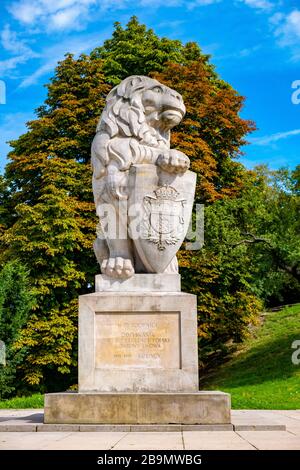 Lublin, Lubelskie / Poland - 2019/08/18: Monumental statue of a lion, symbol of Lviv city in front of medieval Lublin Castle royal fortress in histori Stock Photo