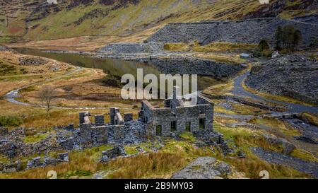 Cwmorthin slate quarry, old slate abandoned  barracks on the mountainside near Blaenau Ffestiniog Snowdonia Stock Photo