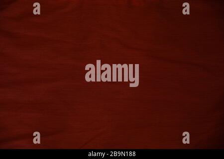 Crumpled burgundy fabric texture background Stock Photo
