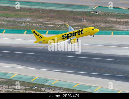 Aerial view of low cost Spirit Airlines Airbus A320 departing Los Angeles International Airport. High view airplane taking off. A320neo N916NK. Stock Photo