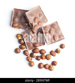 Chocolate bar and hazelnuts isolated on white background. Stock Photo