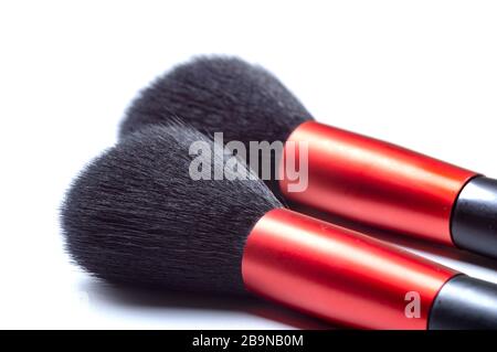 two makeup brushes on a white background. Close-up photo. Stock Photo