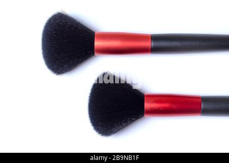 two makeup brushes on a white background, top view. Close-up photo. Stock Photo