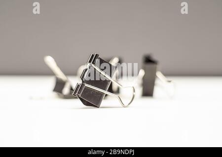 two big black binder clips for paper isolated Stock Photo