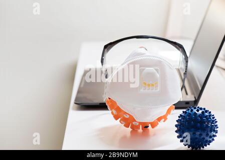 Protecting mask and glasses on the table and microscope virus close up,. Coronavirus concept Stock Photo