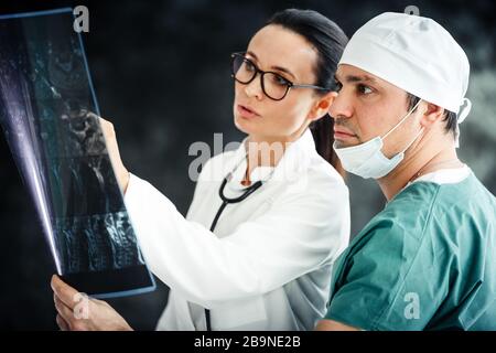 healthcare in hospital concept. two doctors reviewing x-ray results Stock Photo