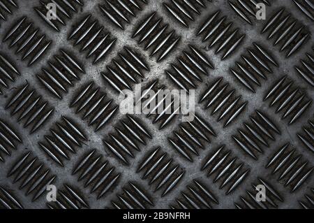 Metal floor with corrugated surface close-up. Corrugated aluminum sheet, background texture Stock Photo