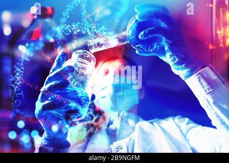 Female doctor in the laboratory performs chemical tests with ampoules in a protected environment Stock Photo