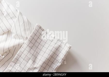 White striped and checkered tablecloth close-up, isolated on white with copy space Stock Photo