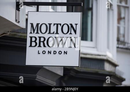 A sign sits above a Molton Brown shop in Guildford, Surrey U.K.Friday, March 20, 2020 Stock Photo