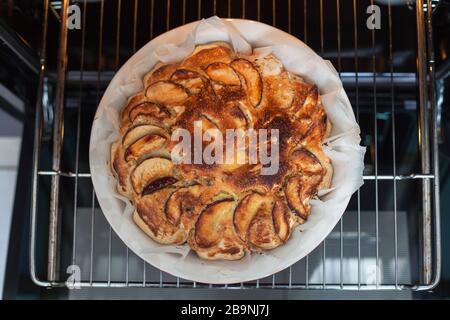 Delicious apple pie freshly baked at home in the oven. Apple Charlotte Homemade baking. Vegan cake in a baking dish. top view, flat lay Stock Photo