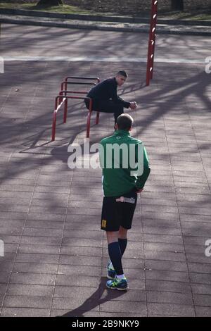 At the Belgrade Sports and Recreation Center, two young men are taking a break from their activities. Stock Photo