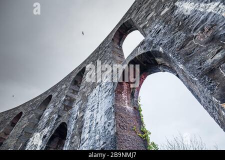 Inner shell of McCaig's tower against cloudy sky background in Oban - West Coast of Scotland Stock Photo