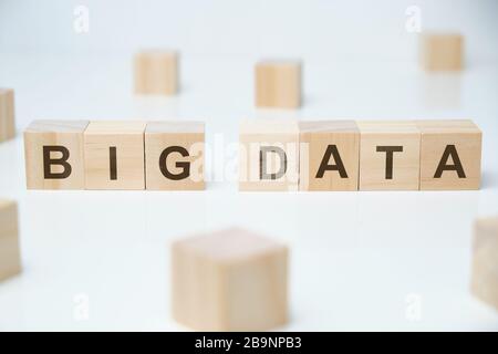 Wooden blocks on a white background with the inscription - big data. Close up. Stock Photo