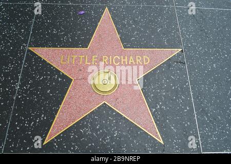 The Hollywood Walk of Fame comprises more than 2,600 five-pointed terrazzo and brass stars embedded in the sidewalks  of Hollywood Boulevard Stock Photo