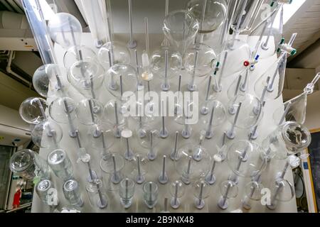 Glasswares on a hanger in a laboratory Stock Photo
