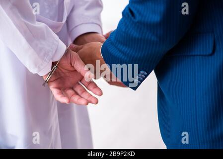Doctor in courthouse meeting with lawyer Stock Photo