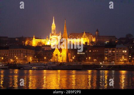 Illuminated beautiful building reflecting on the lake at night in Budapest, Hungary Stock Photo