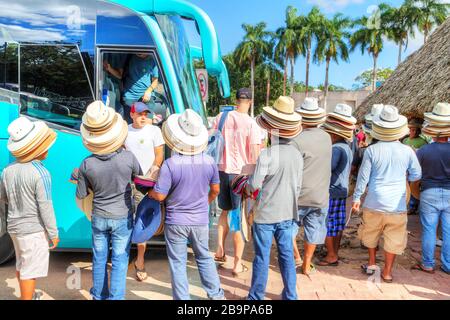 Chichen Itza, Mexico - Dec. 23, 2019: Tourists stepping out of a tour bus to visit Chichen Itza, the largest archaeological city of the pre-Columbian Stock Photo