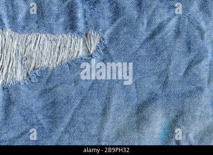 Old denim japan jean texture. Jeans torn denim texture. Denim jeans ripped destroyed Stock Photo